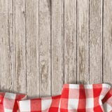 Παλαιό ξύλινο επιτραπέζιο υπόβαθρο με το τραπεζομάντιλο πικ-νίκ Στοκ φωτογραφία με δικαίωμα ελεύθερης χρήσης Παλαιό ξύλινο επιτραπέζιο υπόβαθρο με το τραπεζομάντιλο πικ-νίκ Στοκ φωτογραφία με δικαίωμα ελεύθερης χρήσης