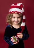 Παιδί Chirstmas που φορά το καπέλο νεραιδών Santa Κόκκινες διακοπές χειμώνας Backgr στοκ εικόνες με δικαίωμα ελεύθερης χρήσης Παιδί Chirstmas που φορά το καπέλο νεραιδών Santa Κόκκινες διακοπές χειμώνας Backgr στοκ εικόνες με δικαίωμα ελεύθερης χρήσης