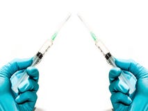 Παραδίδει τα γάντια με δύο σύριγγες στοκ εικόνα Παραδίδει τα γάντια με δύο σύριγγες στοκ εικόνα