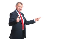 Το επιχειρησιακό άτομο δείχνει την πλευρά και εγκρίνει στοκ εικόνες Το επιχειρησιακό άτομο δείχνει την πλευρά και εγκρίνει στοκ εικόνες