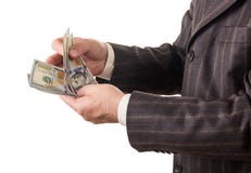Χρήματα στα χέρια επιχειρηματιών που απομονώνονται στο λευκό Στοκ φωτογραφίες με δικαίωμα ελεύθερης χρήσης Χρήματα στα χέρια επιχειρηματιών που απομονώνονται στο λευκό Στοκ φωτογραφίες με δικαίωμα ελεύθερης χρήσης