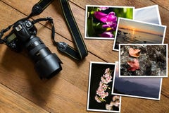 Ψηφιακή κάμερα DSLR και σωρός των φωτογραφιών στο εκλεκτής ποιότητας ξύλινο υπόβαθρο grunge στοκ φωτογραφία με δικαίωμα ελεύθερης χρήσης Ψηφιακή κάμερα DSLR και σωρός των φωτογραφιών στο εκλεκτής ποιότητας ξύλινο υπόβαθρο grunge στοκ φωτογραφία με δικαίωμα ελεύθερης χρήσης