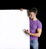 Όμορφος νεαρός άνδρας με τη μεγάλη κενή επίδειξη στοκ φωτογραφίες με δικαίωμα ελεύθερης χρήσης Όμορφος νεαρός άνδρας με τη μεγάλη κενή επίδειξη στοκ φωτογραφίες με δικαίωμα ελεύθερης χρήσης