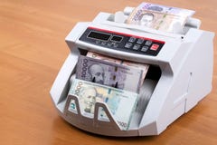 Армянская драхма в считая машине стоковое изображение Армянская драхма в считая машине стоковое изображение