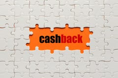 Белые детали головоломки на оранжевых предпосылке и слове Cashback стоковые фотографии rf Белые детали головоломки на оранжевых предпосылке и слове Cashback стоковые фотографии rf