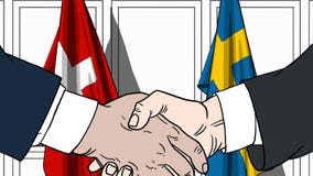 Бизнесмены или политики трясут руки против флагов Швейцарии и Швеции Связанные официальное заседание или сотрудничество бесплатная иллюстрация Бизнесмены или политики трясут руки против флагов Швейцарии и Швеции Связанные официальное заседание или сотрудничество бесплатная иллюстрация