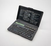 Винтажный карманный складной калькулятор изолированный на белизне стоковое фото rf Винтажный карманный складной калькулятор изолированный на белизне стоковое фото rf
