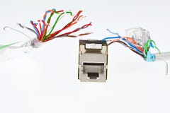 Гнездо сети RJ45 женское погнано 2 кабелями которое выглядеть как щупальца изверга, белой предпосылкой UTP/STP Стоковое Изображение RF Гнездо сети RJ45 женское погнано 2 кабелями которое выглядеть как щупальца изверга, белой предпосылкой UTP/STP Стоковое Изображение RF