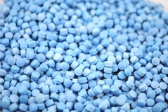 Голубой круг tablets предпосылка крупного плана стоковые изображения Голубой круг tablets предпосылка крупного плана стоковые изображения