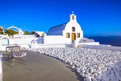 Городок Oia, остров Santorini, Греция на заходе солнца Традиционный и fa стоковые изображения rf Городок Oia, остров Santorini, Греция на заходе солнца Традиционный и fa стоковые изображения rf