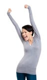 Девушка gesturing triumphal кулачки кладет ее руки вверх стоковое изображение Девушка gesturing triumphal кулачки кладет ее руки вверх стоковое изображение