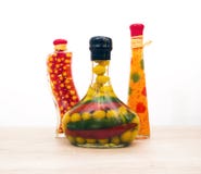 3 декоративных стеклянных загерметизированных бутылки различных форм с овощами стоковая фотография rf 3 декоративных стеклянных загерметизированных бутылки различных форм с овощами стоковая фотография rf
