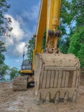 Деятельность dozer экскаватора на месте строительства дорог стоковая фотография rf Деятельность dozer экскаватора на месте строительства дорог стоковая фотография rf