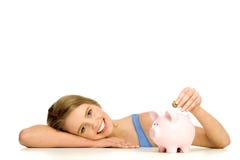 женщина дег банка piggy кладя стоковое изображение rf женщина дег банка piggy кладя стоковое изображение rf