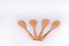 Изолированное handmade ложки Брайна деревянное стоковая фотография rf Изолированное handmade ложки Брайна деревянное стоковая фотография rf