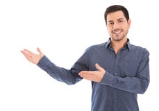 Изолированный усмехаясь человек представляя с его руками Стоковое Фото Изолированный усмехаясь человек представляя с его руками Стоковое Фото