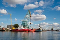 Калининград, Россия - 10-ое сентября 2018: Порт торговлей Калининграда Порт большого русского города с кранами портов, кораблями стоковые фото Калининград, Россия - 10-ое сентября 2018: Порт торговлей Калининграда Порт большого русского города с кранами портов, кораблями стоковые фото