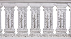 Картина тайской статуи культуры высекла на белой каменной стене Стоковые Фотографии RF Картина тайской статуи культуры высекла на белой каменной стене Стоковые Фотографии RF