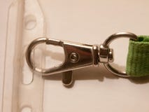 Конец вверх фермуара металла на конце бирки имени ожерелья стоковое изображение Конец вверх фермуара металла на конце бирки имени ожерелья стоковое изображение