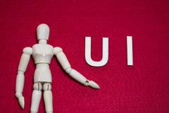 Концепция UI пользовательского интерфейса, деревянная марионетка на красном цвете акриловом чувствовала ткань стоковое фото Концепция UI пользовательского интерфейса, деревянная марионетка на красном цвете акриловом чувствовала ткань стоковое фото