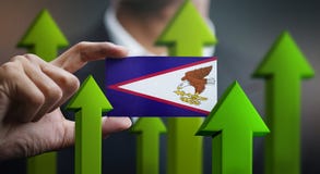 Концепция роста нации, зеленеет вверх по стрелкам - автомобилю удерживания бизнесмена стоковая фотография Концепция роста нации, зеленеет вверх по стрелкам - автомобилю удерживания бизнесмена стоковая фотография