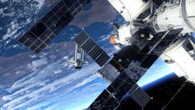 Космический летательный аппарат многоразового использования и космическая станция двигая по орбите сцена Earth Космический летательный аппарат многоразового использования и космическая станция двигая по орбите сцена Earth