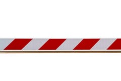 Красный и белый striped барьер изолированный на белой предпосылке стоковое фото rf Красный и белый striped барьер изолированный на белой предпосылке стоковое фото rf