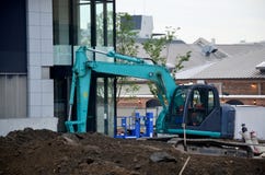 Машинное оборудование Backhoe на строительной площадке стоковое изображение Машинное оборудование Backhoe на строительной площадке стоковое изображение