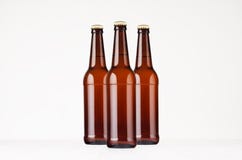 Насмешка пивных бутылок 500ml longneck группы коричневая вверх Стоковая Фотография Насмешка пивных бутылок 500ml longneck группы коричневая вверх Стоковая Фотография