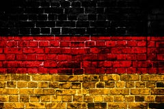 Национальный флаг Германии на предпосылке кирпича стоковая фотография Национальный флаг Германии на предпосылке кирпича стоковая фотография