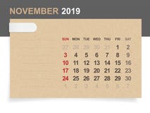Ноябрь 2019 - ежемесячный календарь на предпосылке коричневой бумаги и древесины бесплатная иллюстрация Ноябрь 2019 - ежемесячный календарь на предпосылке коричневой бумаги и древесины бесплатная иллюстрация