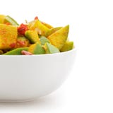 Органическое отрезанное индийское манго (Mangifera indica) в белом шаре Стоковые Изображения RF Органическое отрезанное индийское манго (Mangifera indica) в белом шаре Стоковые Изображения RF