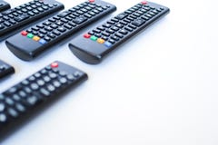 Особенно тяжело запачканные черные дистанционные управления для ТВ на белой предпосылке стоковая фотография rf Особенно тяжело запачканные черные дистанционные управления для ТВ на белой предпосылке стоковая фотография rf