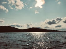 Поздний вечер на озере Winnipesaukee стоковое фото Поздний вечер на озере Winnipesaukee стоковое фото