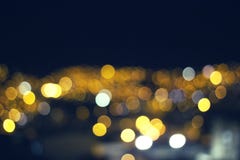 Предпосылка Bokeh города на праздники стоковое изображение rf Предпосылка Bokeh города на праздники стоковое изображение rf