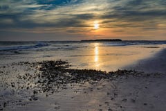 Прибрежный пляж Южная Каролина сумасбродства Mudflats захода солнца предпосылки стоковые изображения rf Прибрежный пляж Южная Каролина сумасбродства Mudflats захода солнца предпосылки стоковые изображения rf