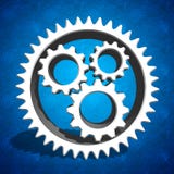 Промышленные шестерни cogs на голубой предпосылке стоковая фотография rf Промышленные шестерни cogs на голубой предпосылке стоковая фотография rf