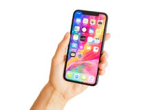 Рига, Латвия - 15-ое марта 2018: Закройте вверх по фото самой последней руки ` s iPhone x поколения лично стоковое фото rf Рига, Латвия - 15-ое марта 2018: Закройте вверх по фото самой последней руки ` s iPhone x поколения лично стоковое фото rf