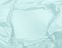 Ровная элегантная голубая текстура ткани шелка или сатинировки роскошная как abstra Стоковое Изображение Ровная элегантная голубая текстура ткани шелка или сатинировки роскошная как abstra Стоковое Изображение