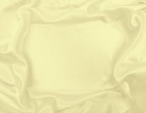 Ровная элегантная золотая текстура ткани шелка или сатинировки роскошная как wedd Стоковые Изображения RF Ровная элегантная золотая текстура ткани шелка или сатинировки роскошная как wedd Стоковые Изображения RF