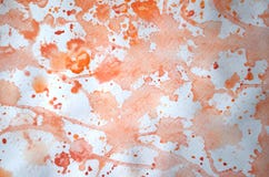 Рука покрасила абстрактную текстуру акварели splatter в monochrome апельсине как предпосылка для космоса экземпляра Стоковое Изображение Рука покрасила абстрактную текстуру акварели splatter в monochrome апельсине как предпосылка для космоса экземпляра Стоковое Изображение