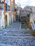 Славный переулок в Matera, месте всемирного наследия ЮНЕСКО - Базиликате, стоковое изображение Славный переулок в Matera, месте всемирного наследия ЮНЕСКО - Базиликате, стоковое изображение