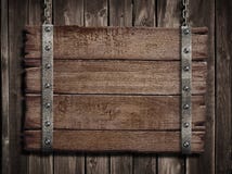 Средневековые деревянные подписывают сверх старую деревянную металлическую пластинку стоковое изображение rf Средневековые деревянные подписывают сверх старую деревянную металлическую пластинку стоковое изображение rf