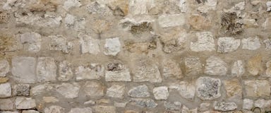 Стена старого гранита каменная с швом цемента, каменной кладкой широким Backgrou стоковая фотография Стена старого гранита каменная с швом цемента, каменной кладкой широким Backgrou стоковая фотография