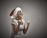Счастливый смеясь над портрет крышки santa девушки Стоковые Фото Счастливый смеясь над портрет крышки santa девушки Стоковые Фото