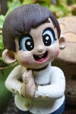 Тайский радушный мальчик куклы штукатурки Стоковая Фотография Тайский радушный мальчик куклы штукатурки Стоковая Фотография