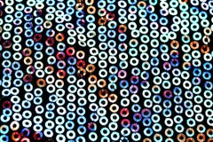 текстурированная предпосылка sequins сияющего круга пестротканых зашитых на ткани для платья вечера стоковые фото текстурированная предпосылка sequins сияющего круга пестротканых зашитых на ткани для платья вечера стоковые фото