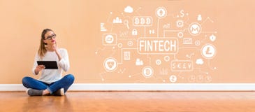 Тема fintech Cryptocurrency при женщина используя таблетку стоковое фото rf Тема fintech Cryptocurrency при женщина используя таблетку стоковое фото rf
