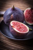 image photo : Sliced figs on a wooden table.
