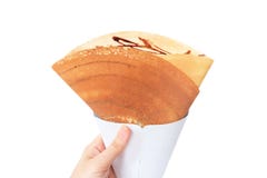 点心巧克力汁用干切细的猪肉弄皱薄煎饼,顶视图 妇女是拿着布朗绉纱的手自创在白色后面 库存照片 点心巧克力汁用干切细的猪肉弄皱薄煎饼,顶视图 妇女是拿着布朗绉纱的手自创在白色后面 库存照片